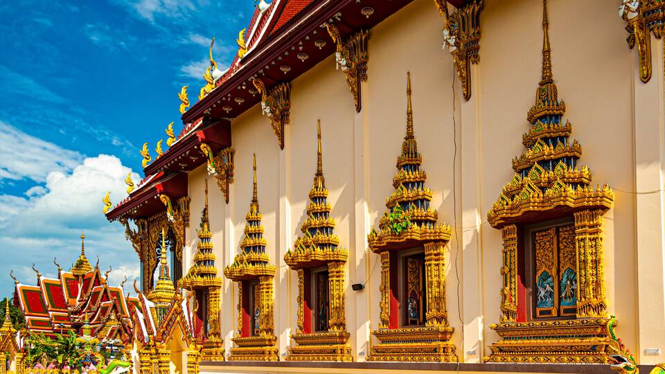 A temple with ornate golden spires and intricate designs.