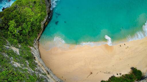Drone Aerial Famous Kelingking Beach in Nusa Penida, Indonesia Zoom Shot