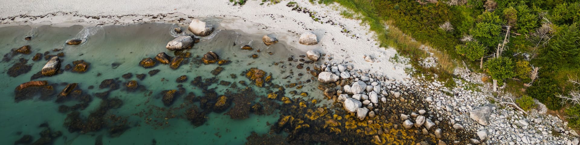 Coastal aerial of Carter’s Beach with tidal river and sandbars