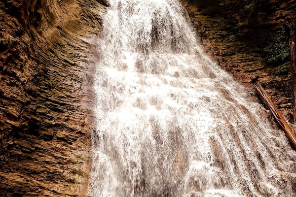 A waterfall cascading down a rocky cliff.