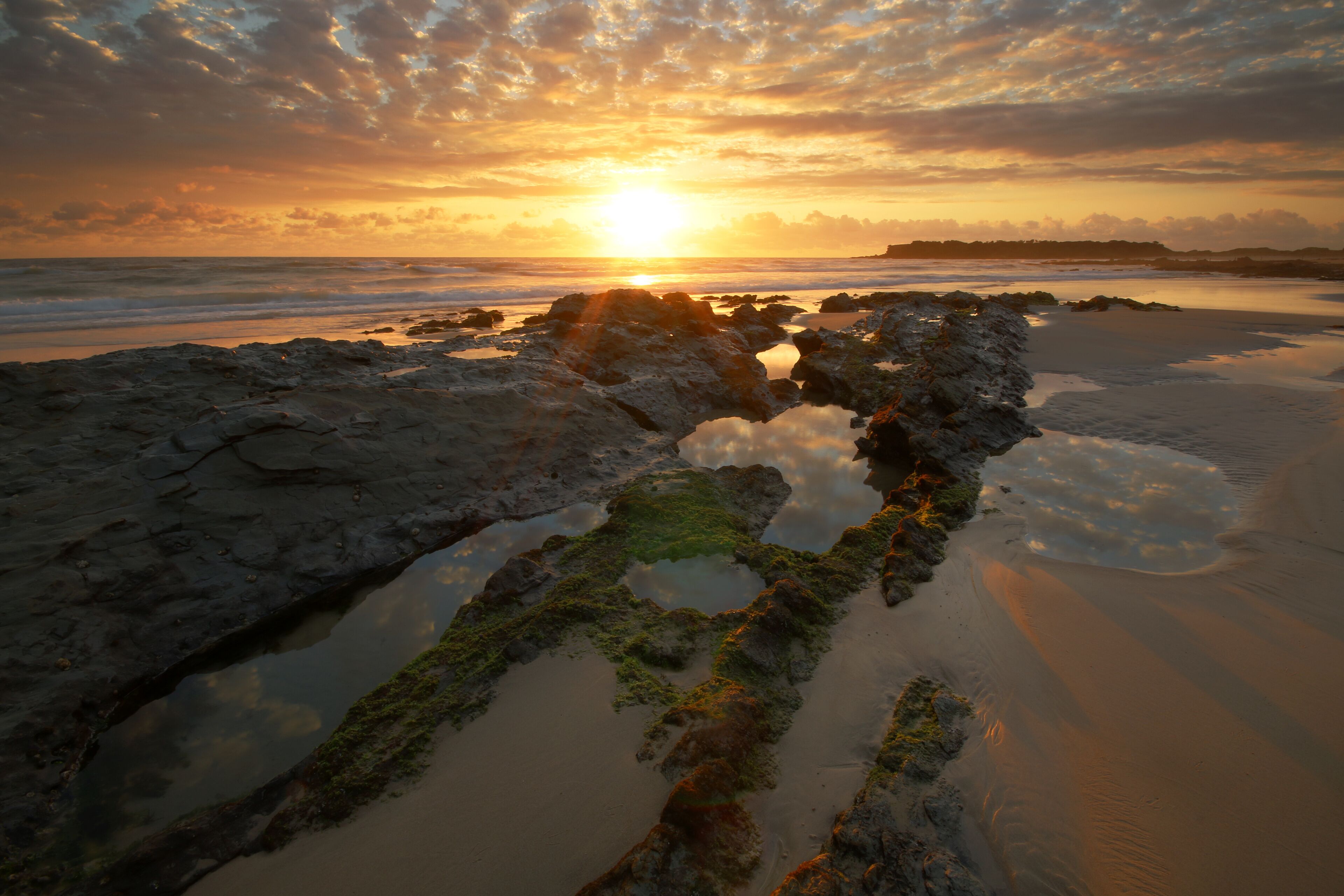 a sunset over a body of water