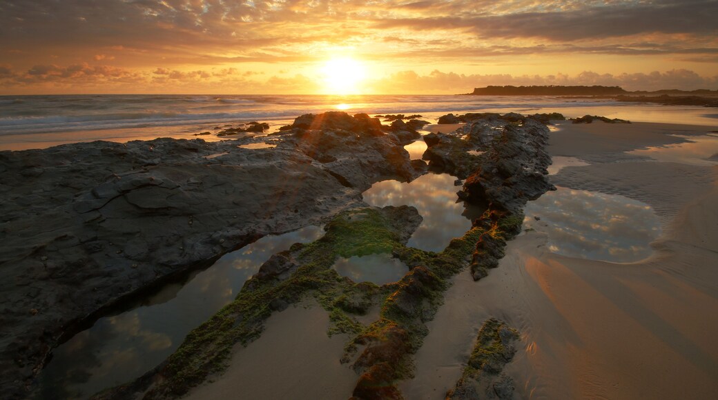 a sunset over a body of water