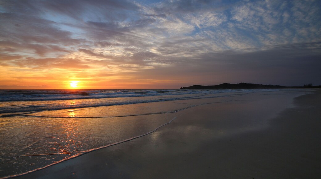 Beautiful sunset on the beach with a dramatic blue sky, Airforce Beach, Australia