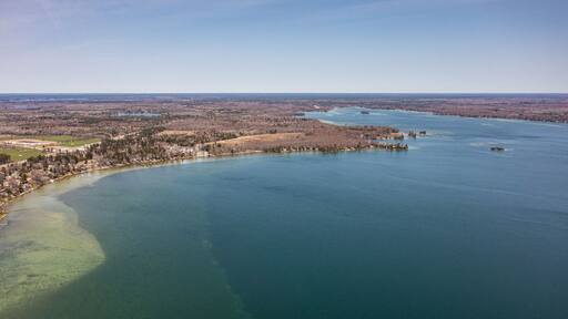 Cumberland beach amigo beach water drone view islands in Ontario Canada summer time blue skies