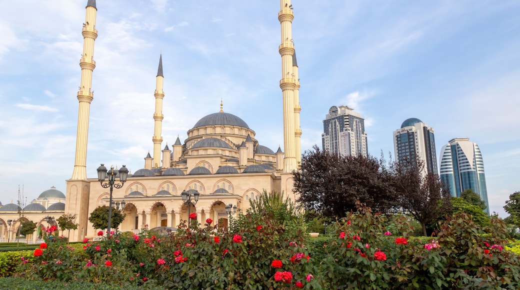 Grozny, Russia: 10.07.2015. Daily life in Chechen Republic. Main mosque of the Chechen Republic - Akhmad Kadyrov Mosque (Heart of Chechnya) and and skyscrapers of Grozny-city