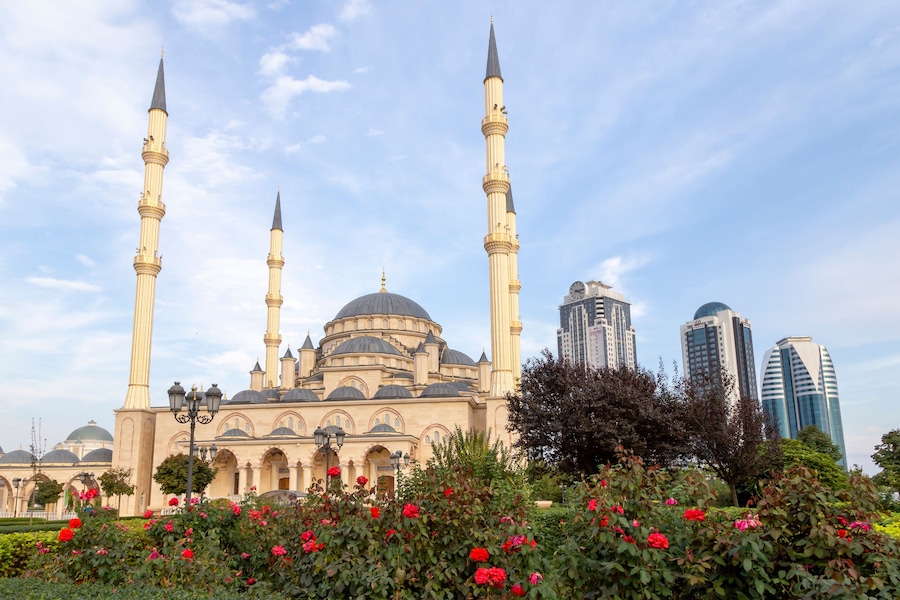 Grozny, Russia: 10.07.2015. Daily life in Chechen Republic. Main mosque of the Chechen Republic - Akhmad Kadyrov Mosque (Heart of Chechnya) and and skyscrapers of Grozny-city