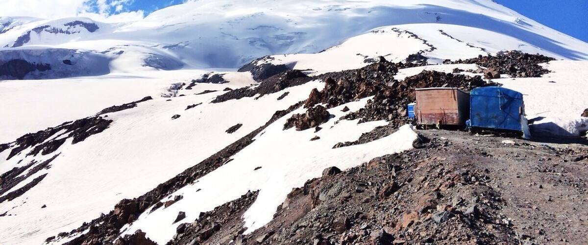 View at Mt. Elbrus - the highest mountain in Europe at 5642m (west summit). It used to be volcano with last eruption in 1st century. There are hot springs around and sometimes noticeable sulphur scent in the air which may indicate volcanic activity.