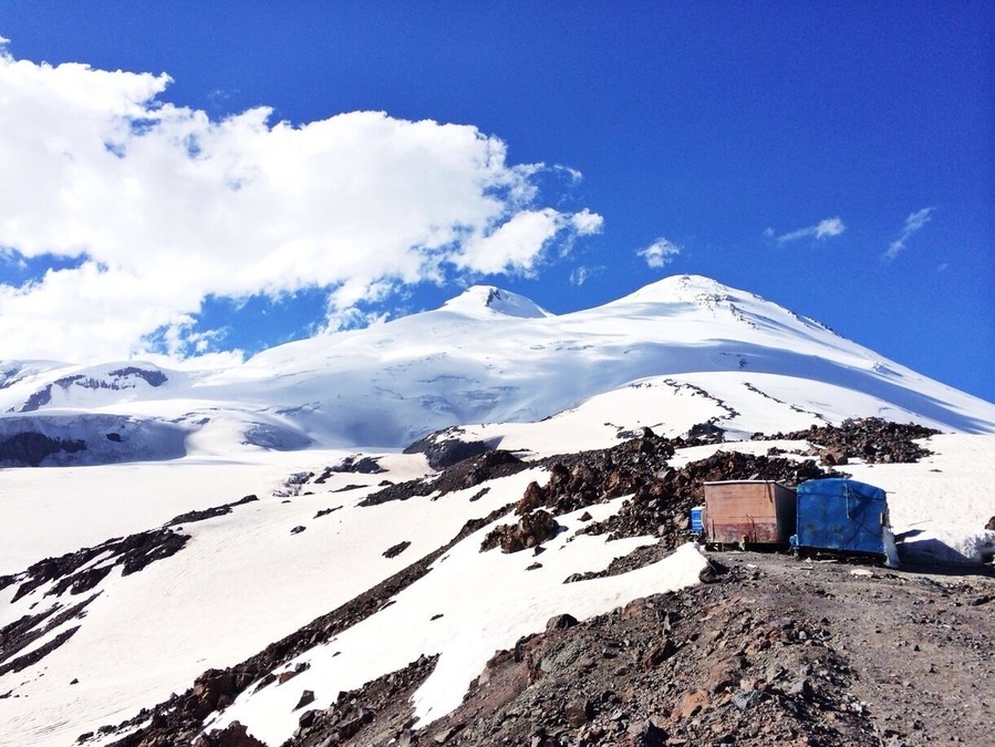 View at Mt. Elbrus - the highest mountain in Europe at 5642m (west summit). It used to be volcano with last eruption in 1st century. There are hot springs around and sometimes noticeable sulphur scent in the air which may indicate volcanic activity.