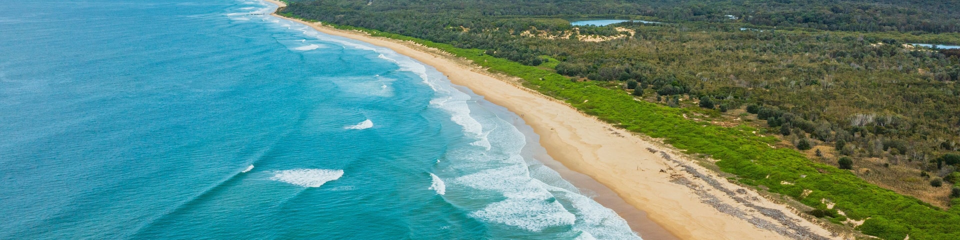 Urunga which includes landscape views, general coastal views and a sandy beach
