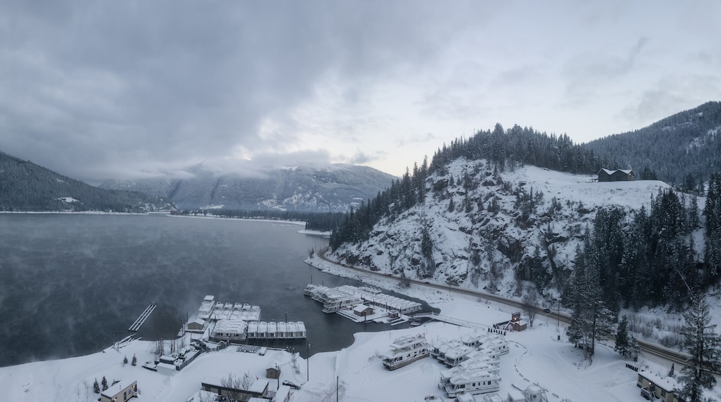 Striking aerial panoramic Canadian Mountain Landscape during a winter morning. Taken at Mara Lake near Sicamous, British Columbia, Canada.