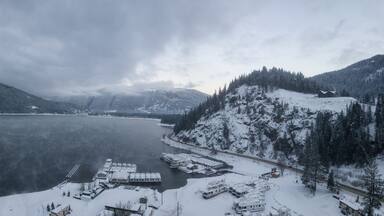 Striking aerial panoramic Canadian Mountain Landscape during a winter morning. Taken at Mara Lake near Sicamous, British Columbia, Canada.