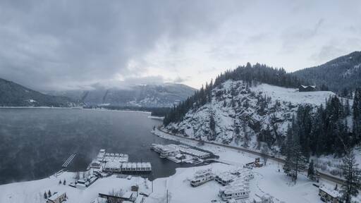Striking aerial panoramic Canadian Mountain Landscape during a winter morning. Taken at Mara Lake near Sicamous, British Columbia, Canada.