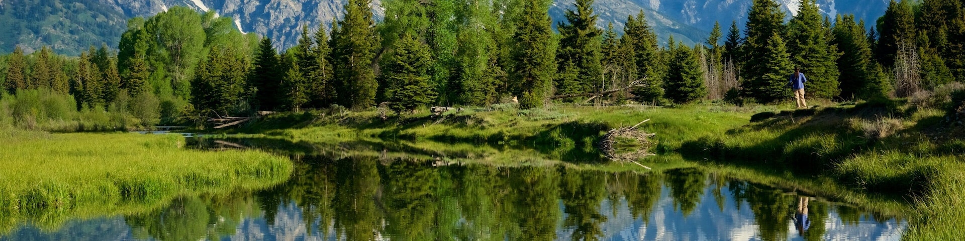 Schwabacher\'s Landing showing a river or creek, mountains and tranquil scenes