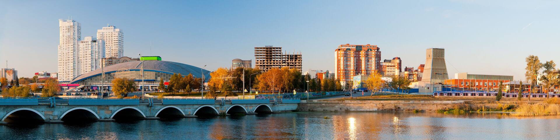Panorama of the autumn embankment of the river Miass
