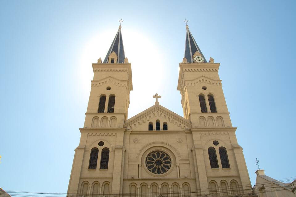 A church with two towers and a large central window.