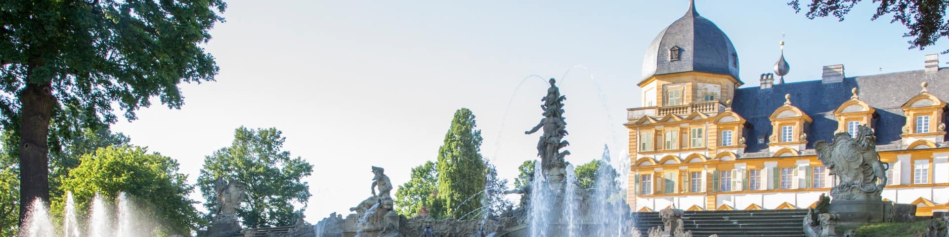 Seehof Palace featuring heritage architecture and a fountain