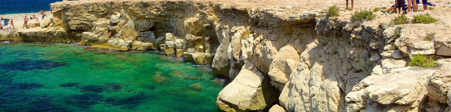 Bugibba Beach showing rocky coastline
