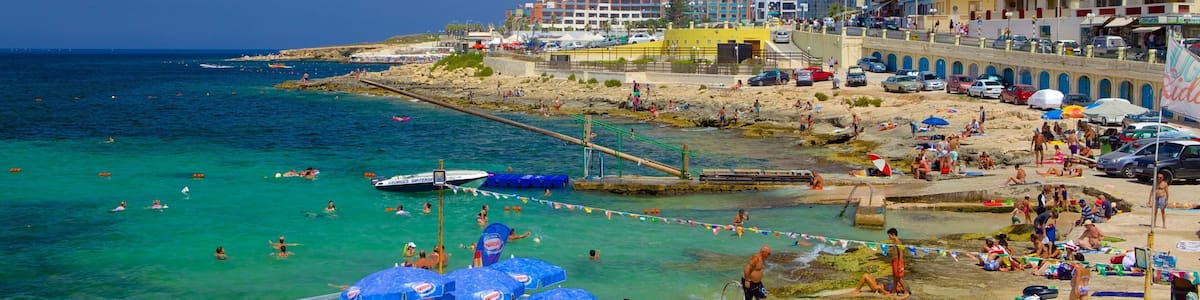 Bugibba Beach which includes a beach and general coastal views