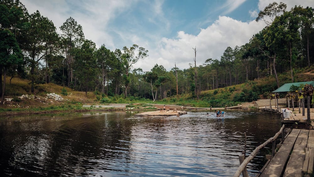 There are many attractions very close to the dusty, crowded and noisy city of PhnomPenh in Cambodia . Kirirom (Mountain of joy) NationalPark is one among them, a nice day trip about 100 km from the city , depending on traffic, should be a 2.5 to 3 hours drive. And specially interesting is the Chambok Ecotourism site.
Located in the Kampong Speu Province , this beautiful landscape was a visual treat. I could witness the whole scene change right before my eyes as the climb towards the Mountains started. This mountain had varied colours of flora at different heights and is completely different to what you see elsewhere in the country.
If you are ever in this mountain / National Park, do not miss the opportunity to sit by a river or a #lake or a waterfall and experience the calm of the wilderness. There were tiny fish in the slow waters, kingfishers nearby waiting for their catch, the pine forests at a distance and loads of butterflies
You get to see carefree kids come in for a dip in this river just after lunch time and have the time of their life. What surprised me was their genuine happiness without those hi tech gadgets. The river was their joy and a few wooden planks assembled on top of 4 large / empty plastic cans was their joy ride in the river. Nothing seemed to stop them from being wild and happy!