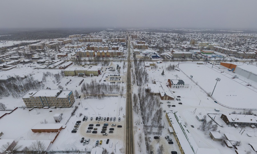 Sovetskiy city. Sports complex and stadium. Aerial. Winter, snow, cloudy. Khanty Mansiysk Autonomous Okrug (HMAO), Russia.