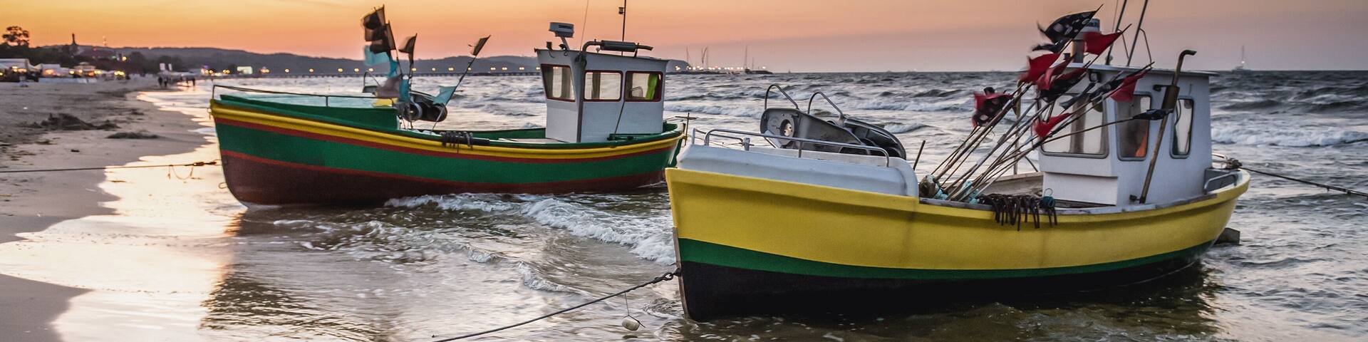 Fishing boats on Baltic Sea beach in Karlikowo District in Sopot city, Poland