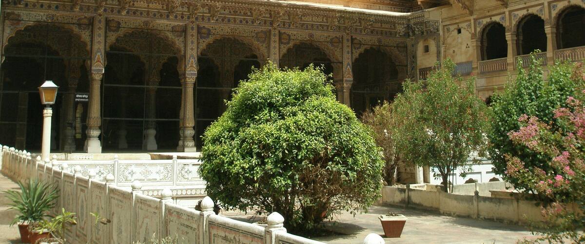 Karauli City Palace, former residence of the royal family. This palace is ornamented with stucco work & frescoes dating from the 18th century
