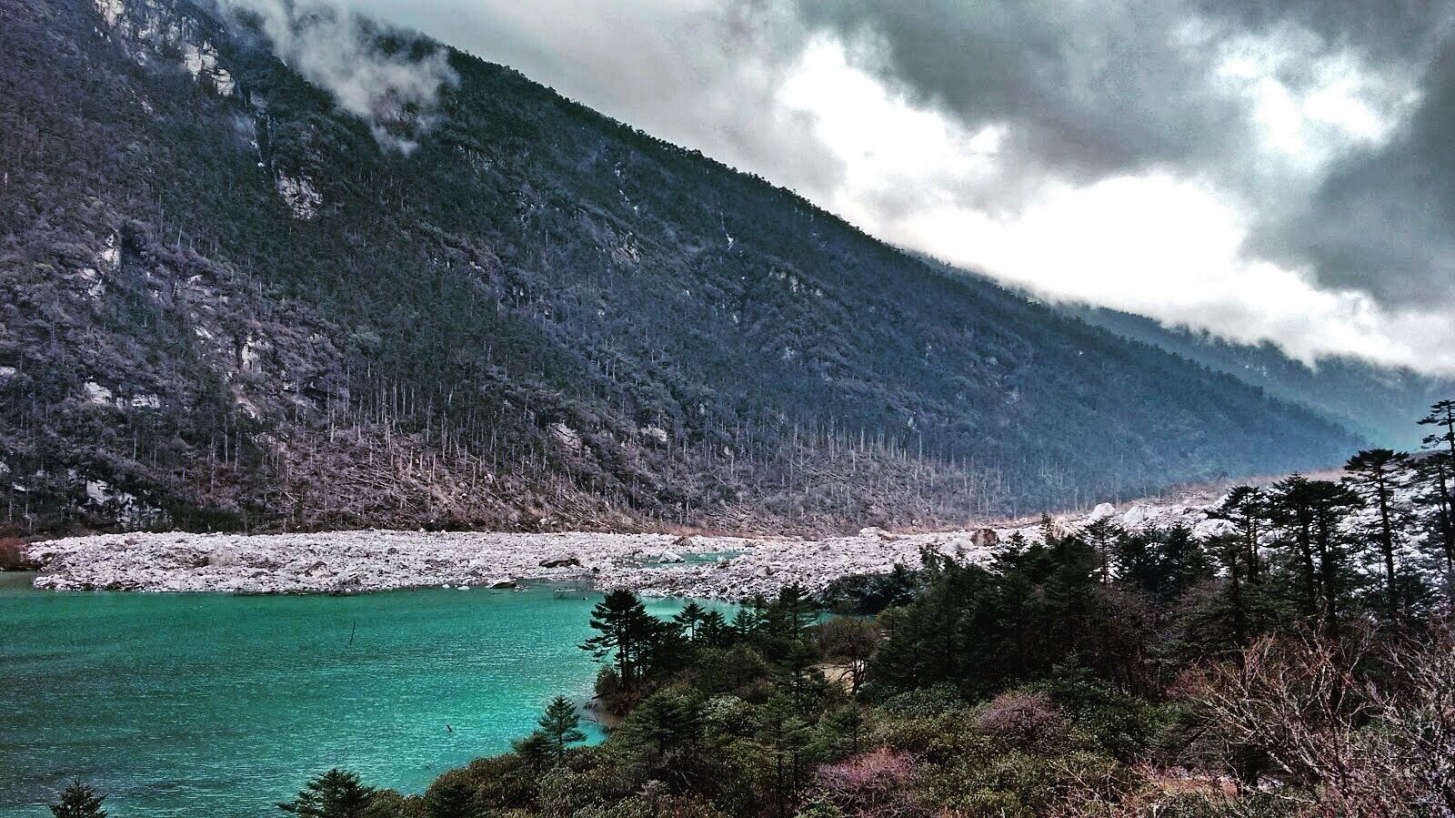 Clouds hugging the mountains.. Making it as a beautiful landscape!! #himalayas #clouds #lake