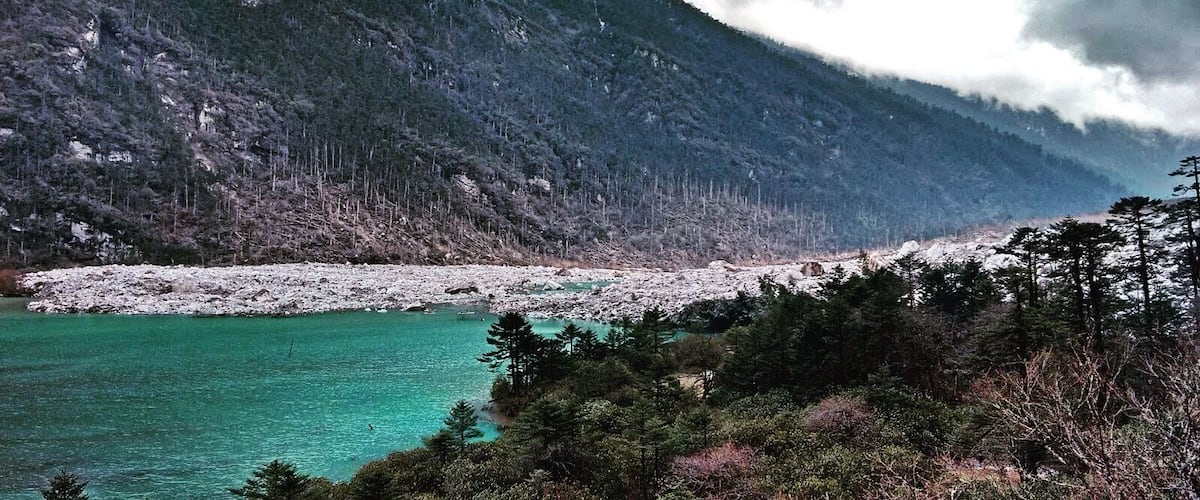 Clouds hugging the mountains.. Making it as a beautiful landscape!! #himalayas #clouds #lake