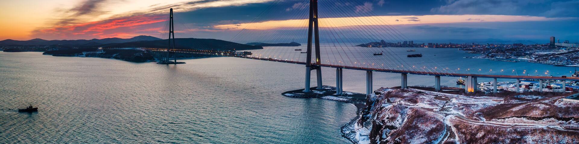 Winter panoramic view of sunset over famous cable-stayed bridge from Vladivostok to Russky Island, Far East of Russia