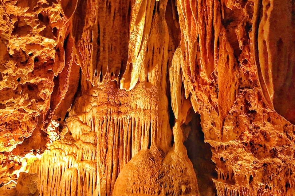 A cave with stalactites and stalagmites.