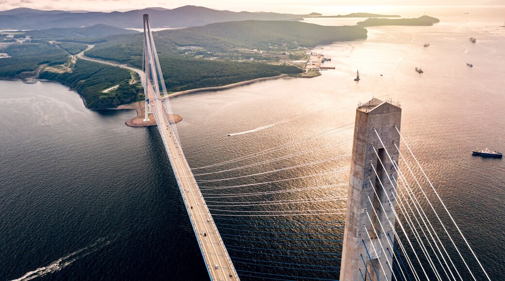 Aerial view of the Russky Bridge connecting Vladivostok city with the Russky Island over the Strait of Eastern Bosphorus. Cable-stayed road bridge over the sea in Primorsky Krai, Far East, Russia