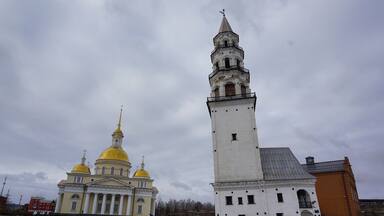 From this perspective it looks like both of them are leaning, but in reality the tower is the only one off kilter. (Well, I'm off balance too.) The church is perfectly normal.