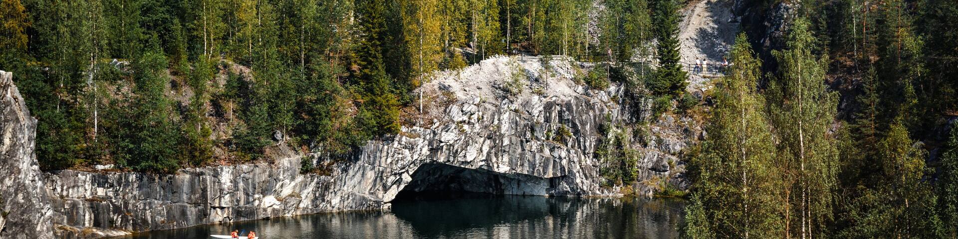 The marble quarry "Ruskeala" filled with groundwater. Nature of Karelia. Summer in the northern forests.