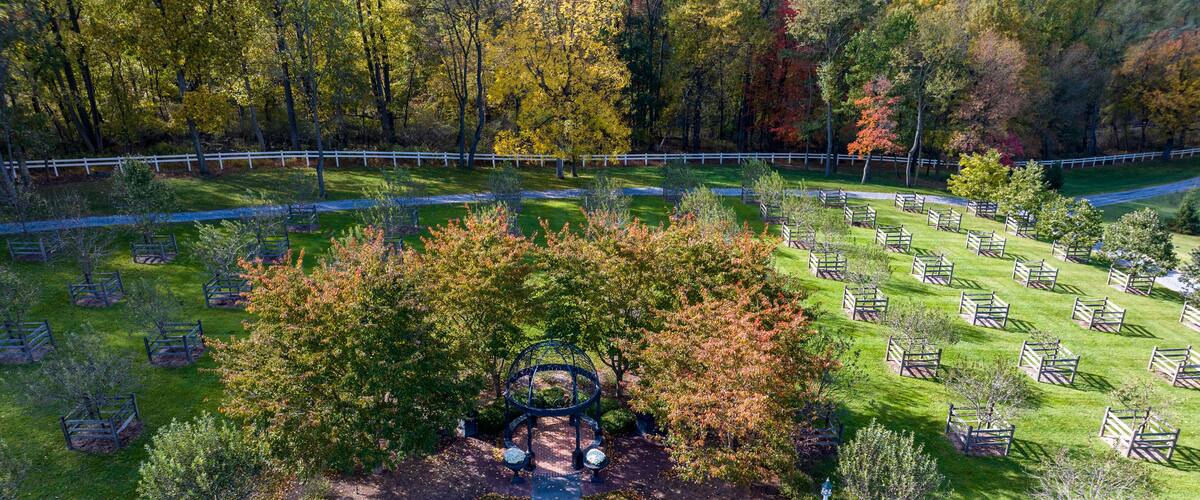Elizabethtown, Pennsylvania, October 22, 2023 - An Aerial View of a Iron Gazebo in the Center of an Orchard on an Autumn Day
