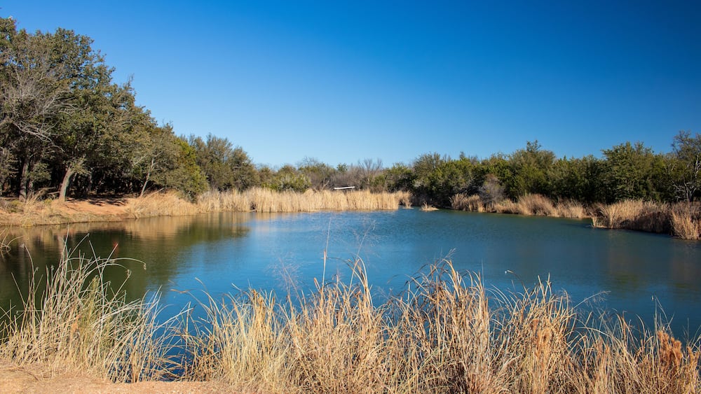 A beautiful fishing pond in a nature park located in Abilene State Park Texas