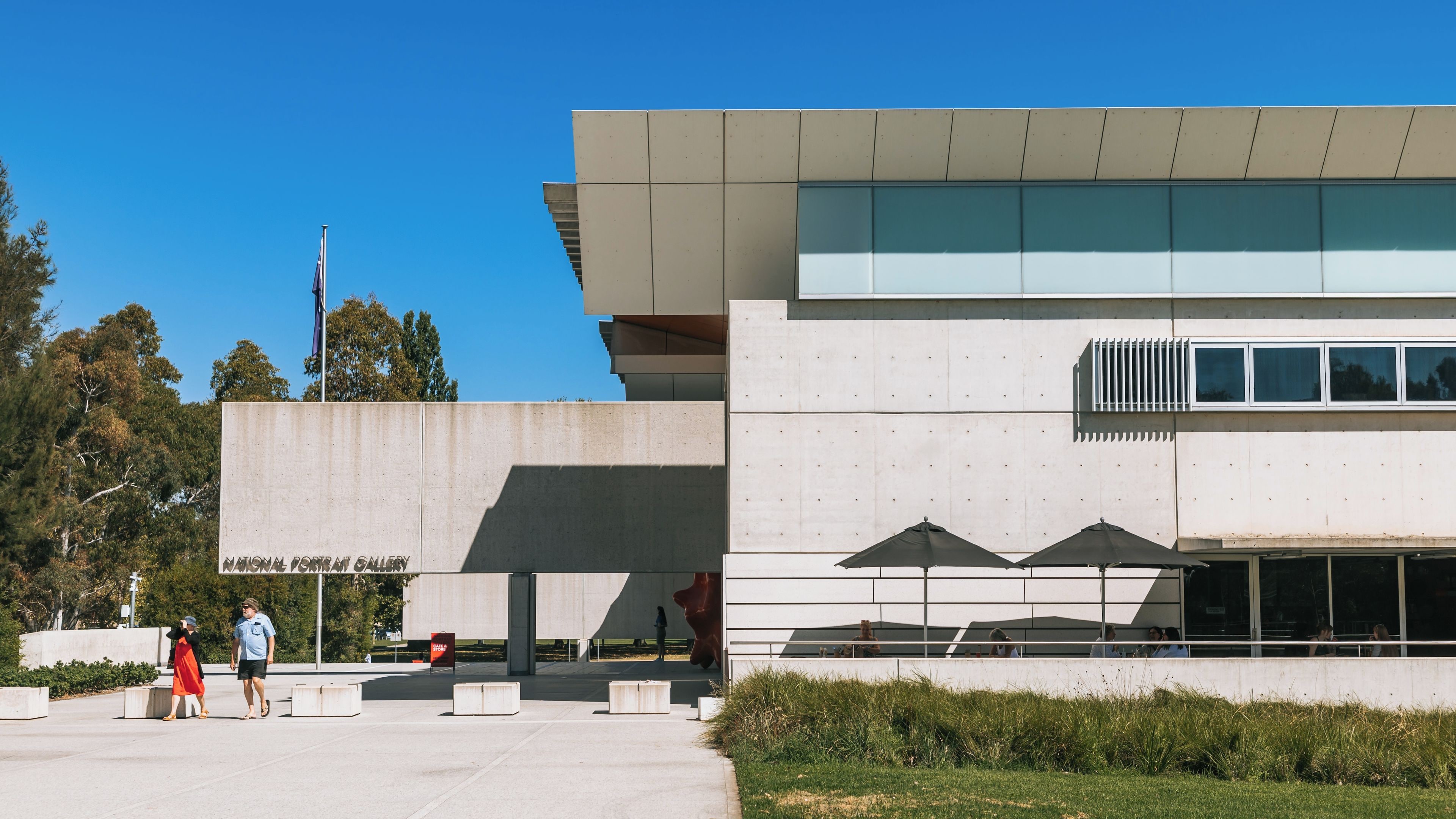 A modern building with a sign reading 'National Portrait Gallery'.