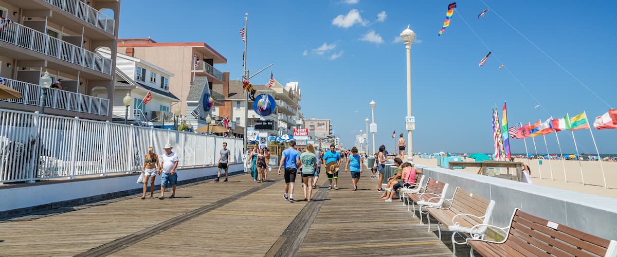 Ocean City Boardwalk which includes a sandy beach and street scenes