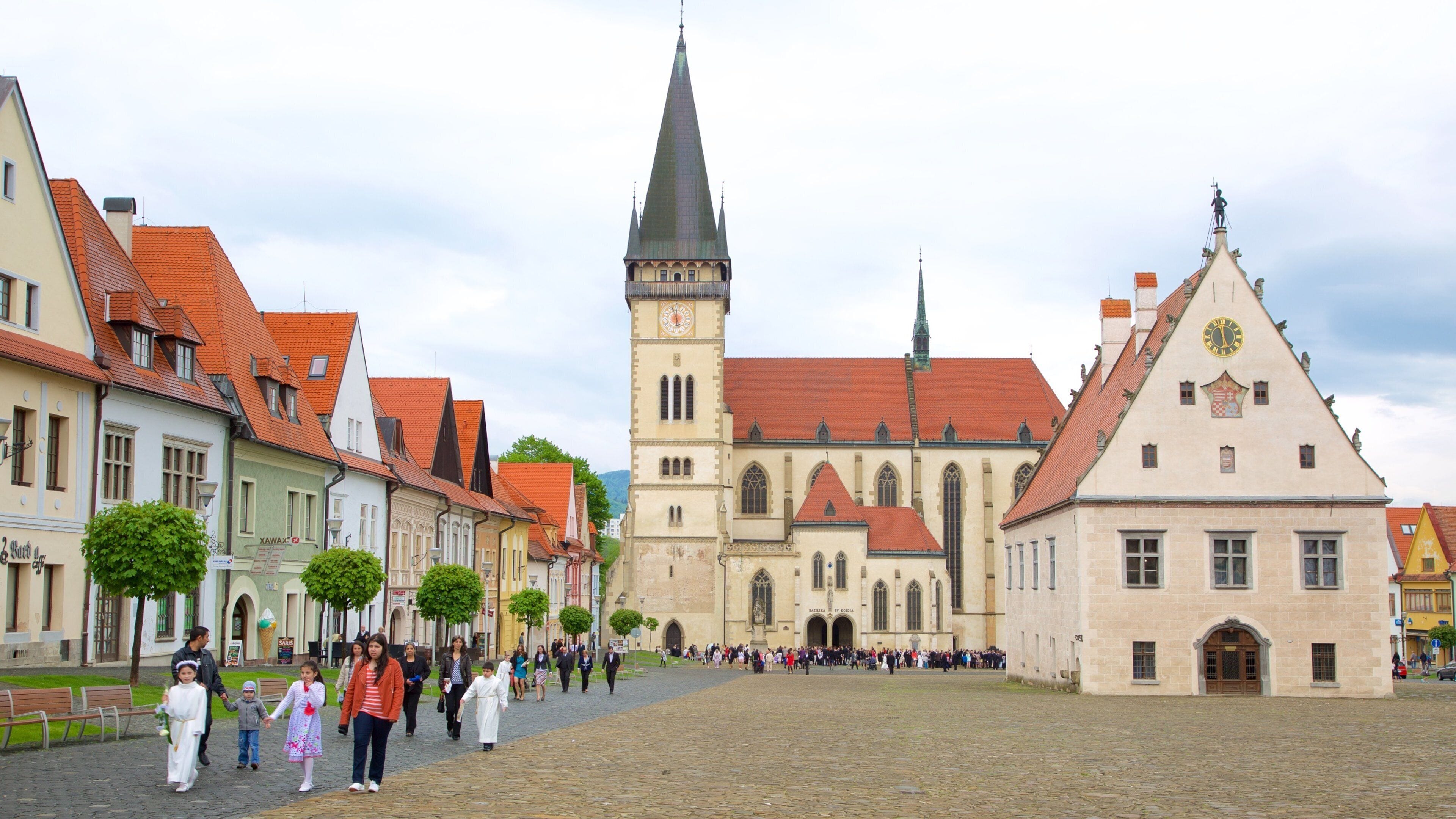 Church of St. Aegidius featuring a city and a square or plaza as well as a small group of people