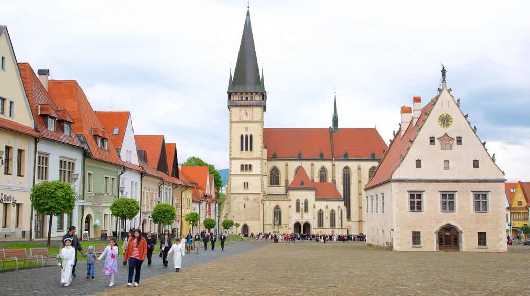 Church of St. Aegidius featuring a city and a square or plaza as well as a small group of people