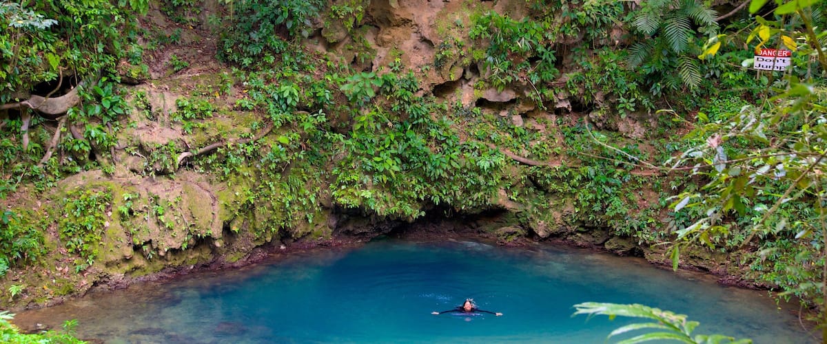 Blue Hole National Park featuring a lake or waterhole, swimming and tranquil scenes