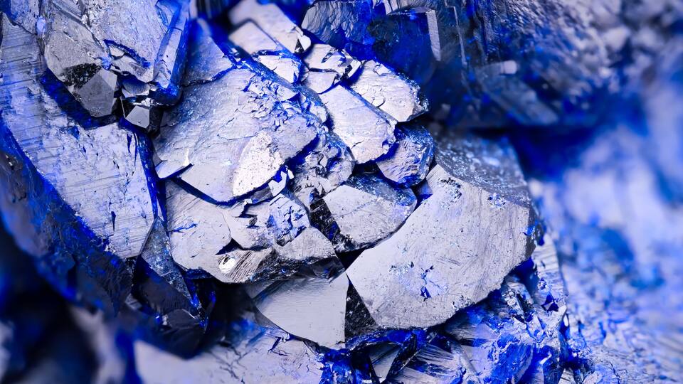 A close-up of blue and silver mineral formations.