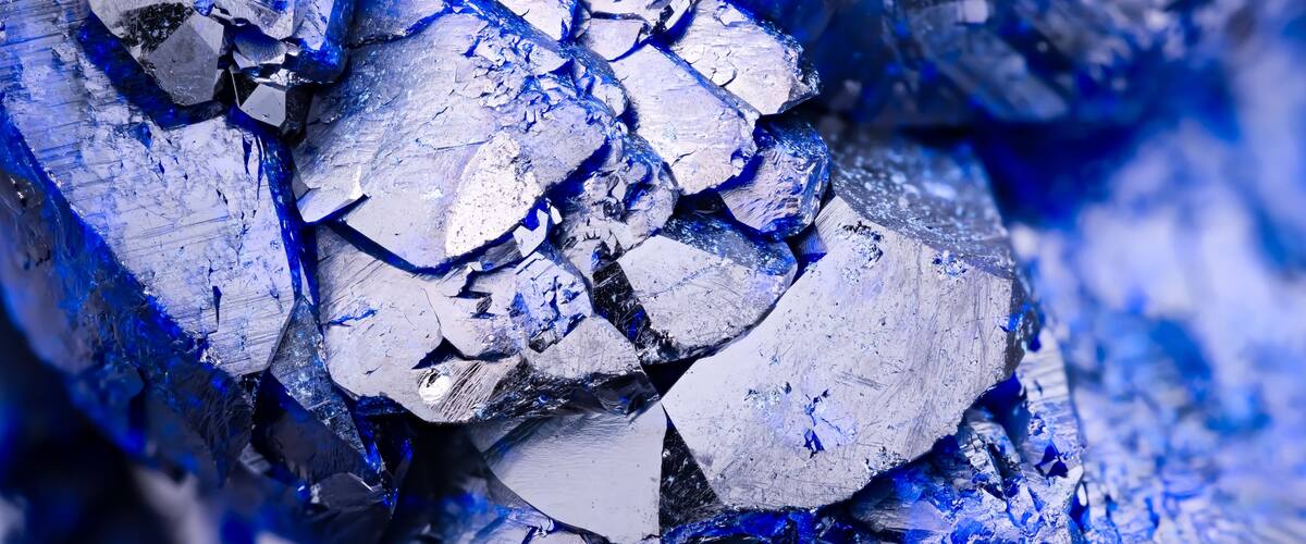 A close-up of blue and silver mineral formations.