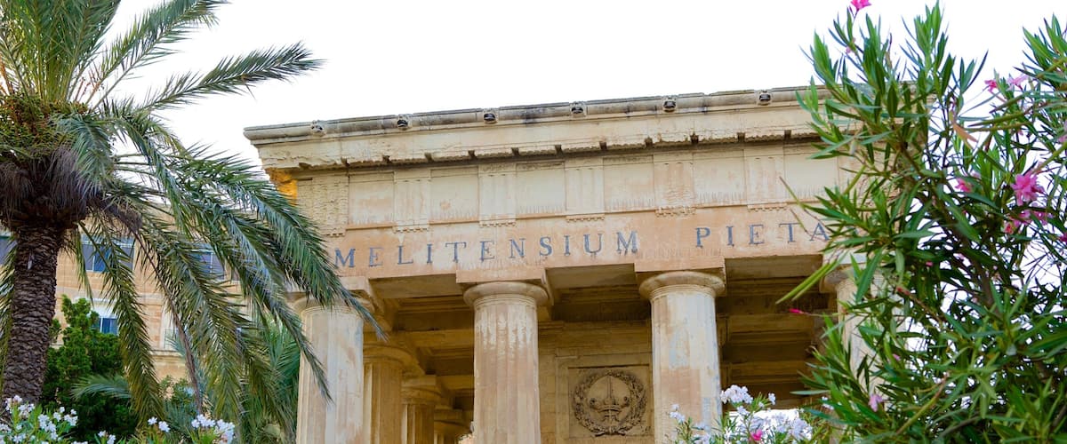 Lower Barrakka Gardens showing flowers, a garden and heritage architecture
