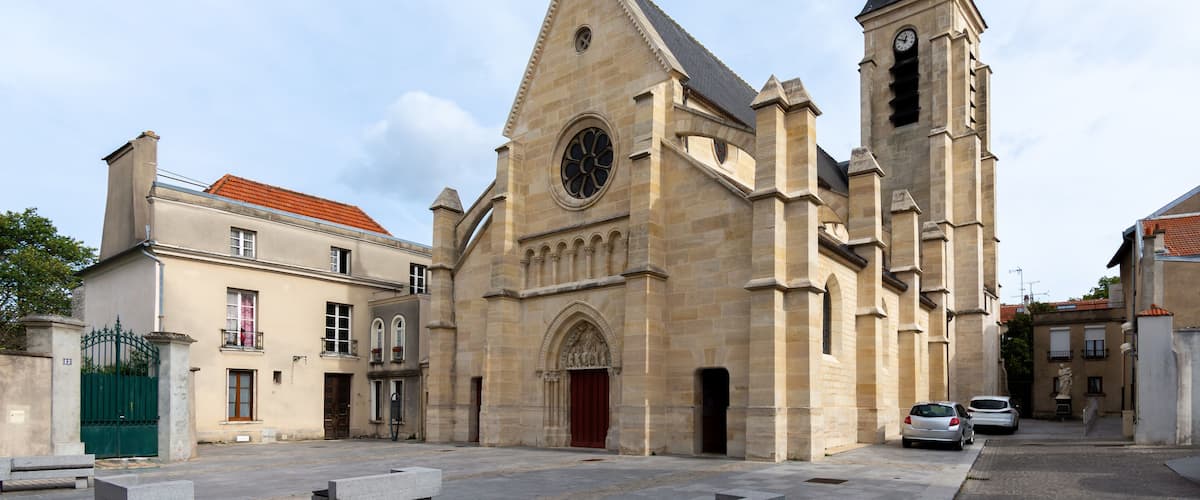A historic church with a tall steeple and a clock tower.