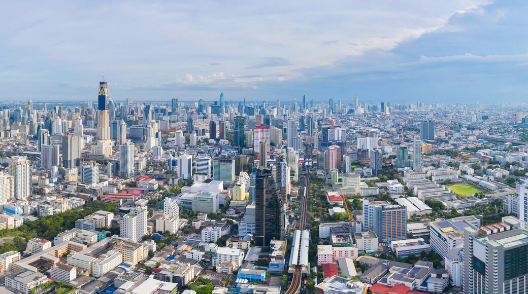 Aerial view of Phaya Thai district, Bangkok Downtown Skyline. Thailand. Financial district and business centers in smart urban city in Asia. Skyscraper and high-rise buildings at sunset.