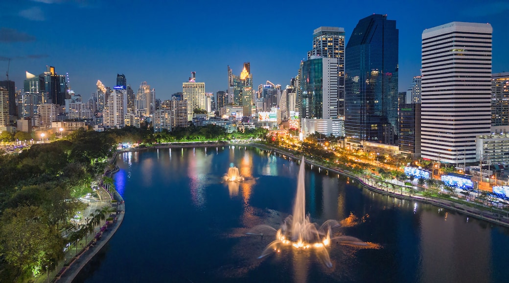 Aerial evening view from Benchakitti Park towards Asok in Bangkok, Thailand.