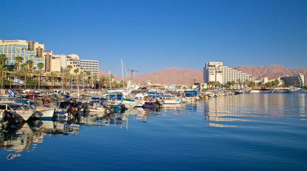 Eilat Marina which includes a bay or harbor and a luxury hotel or resort