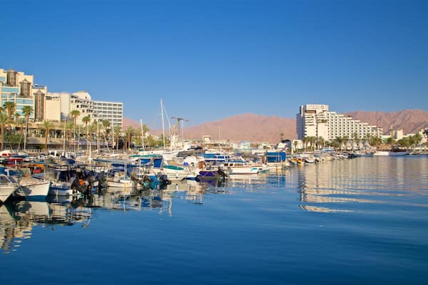 Eilat Marina which includes a bay or harbor and a luxury hotel or resort