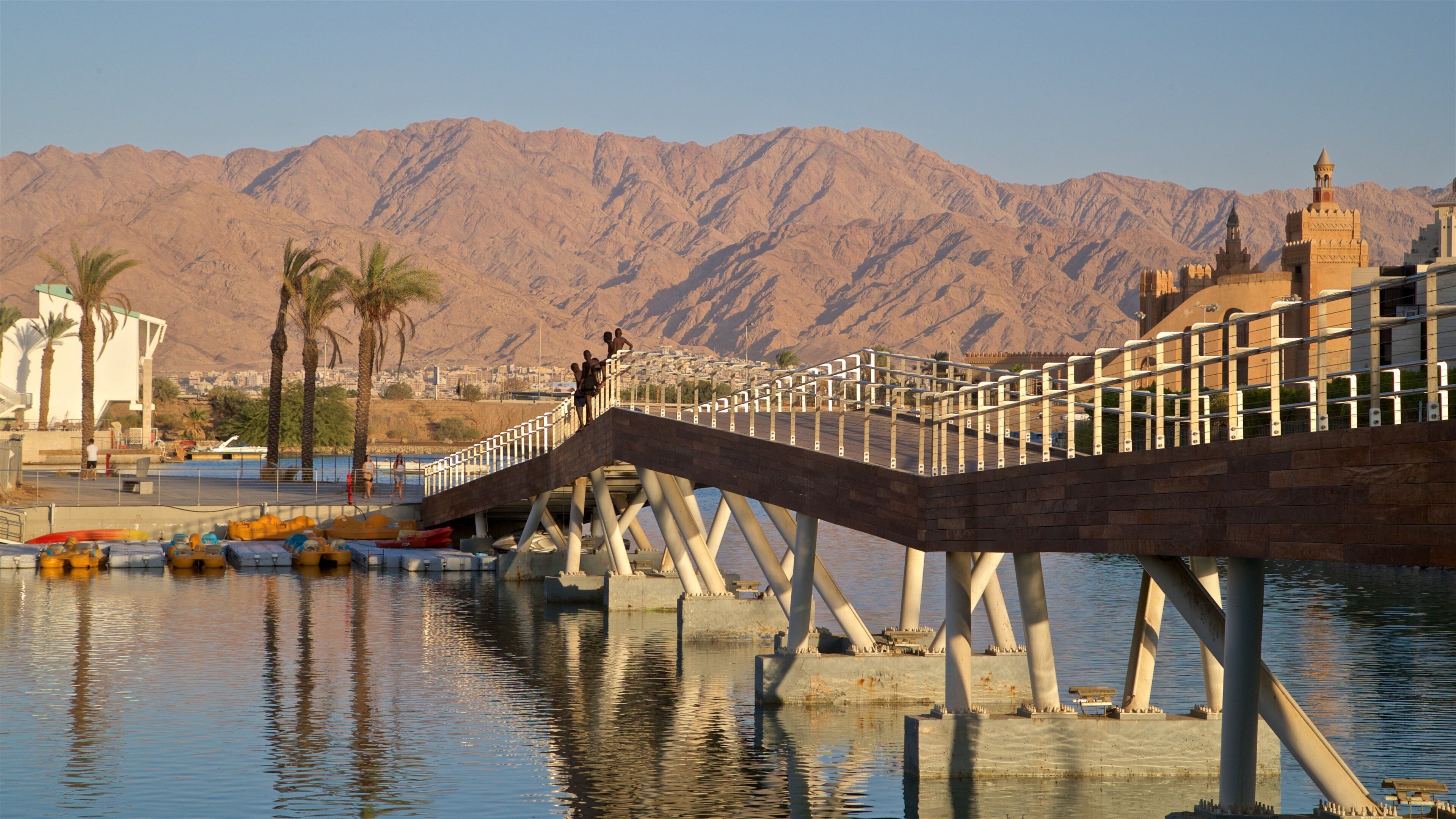Eilat Marina which includes mountains, a river or creek and a bridge