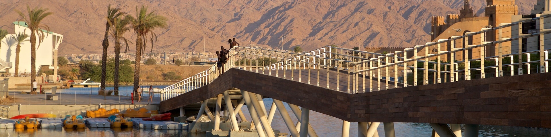 Eilat Marina which includes mountains, a river or creek and a bridge